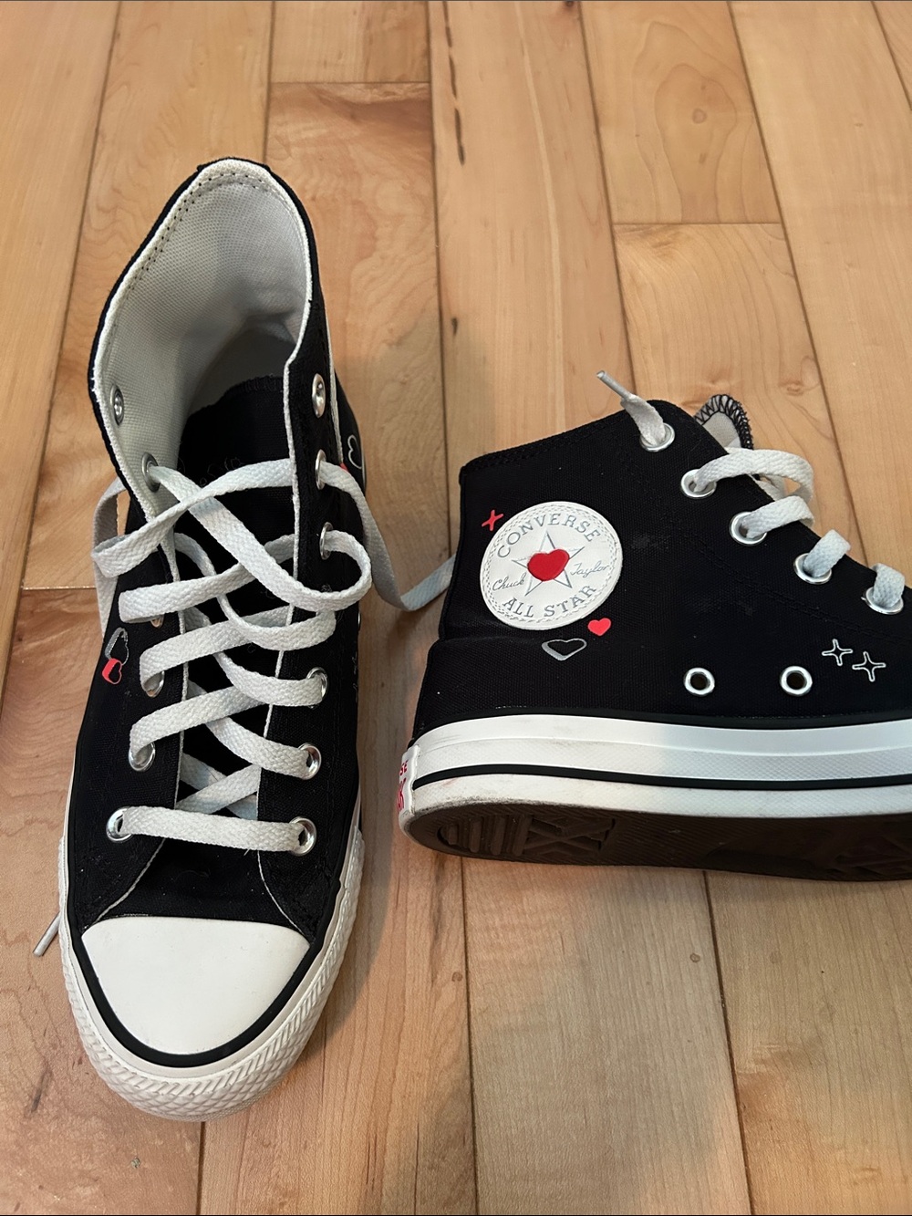 Converse Black High Top Sneakers with White Laces and Red Heart Detail